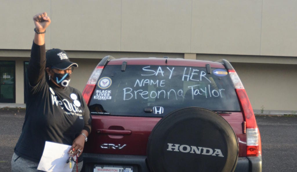 . Oletha Wade Matthews shows her support during a speech calling for justice for Breonna Taylor before a car rally in Vancouver on Thursday, Sept.