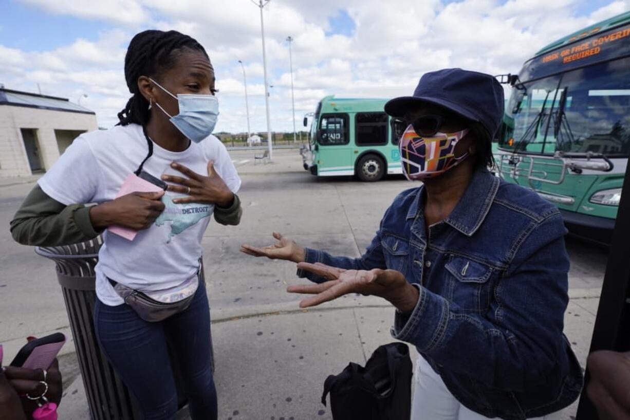 Wendy Caldwell-Liddell, left, who helped start Mobilize Detroit, a newly formed grassroots organization, talks to Margaret Roberts about voting in Detroit, Friday, Sept. 18, 2020. Both President Donald Trump and Democratic presidential nominee Joe Biden are battling for support among Black voters across Michigan, and Biden&#039;s running mate, Sen. Kamala Harris, will be in the state on Tuesday, Sept. 22.