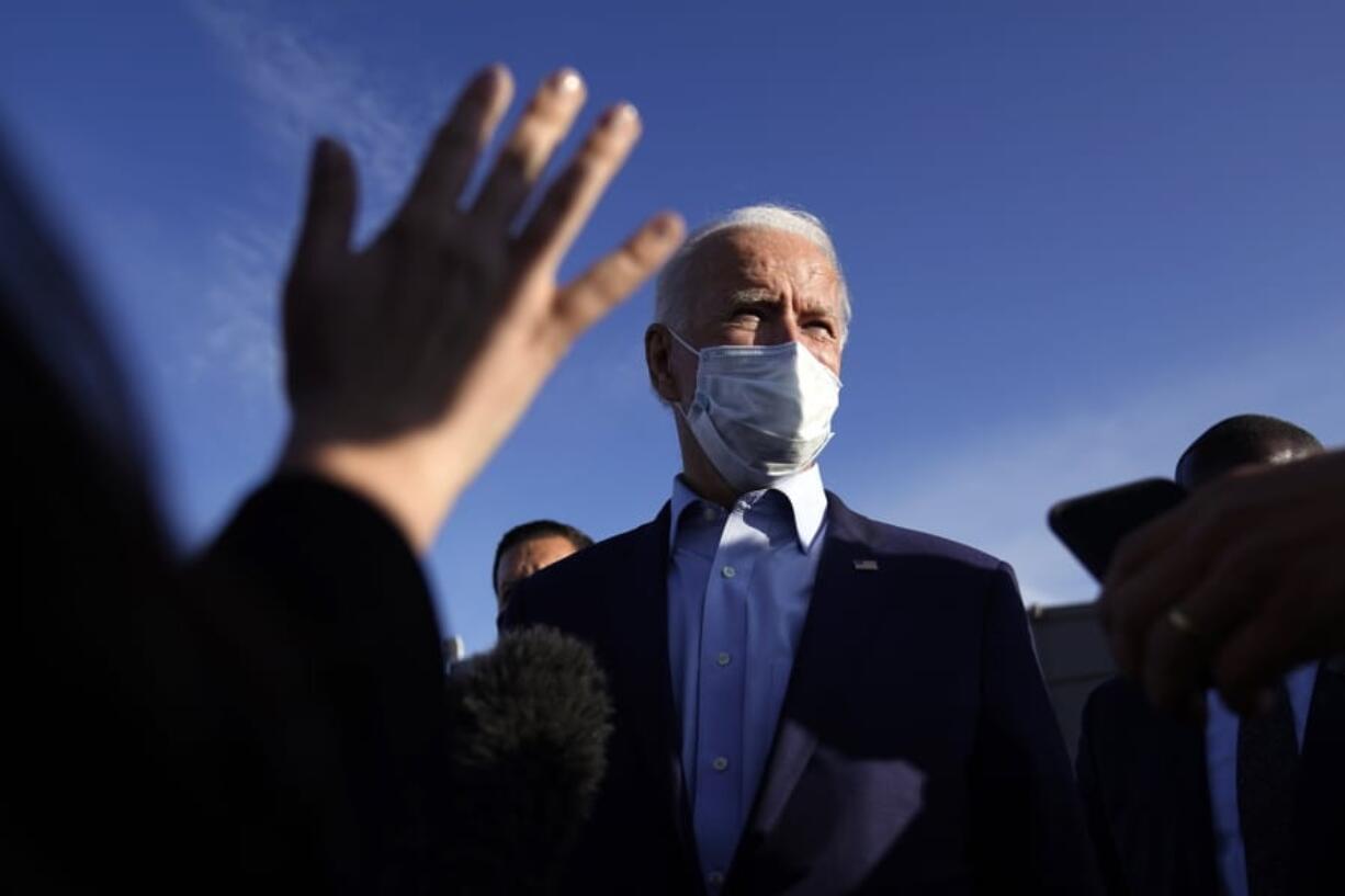 Democratic presidential candidate former Vice President Joe Biden speakers to reporters before he boards his plane at Duluth International Airport, in Duluth, Minn., Friday, Sept. 18, 2020.