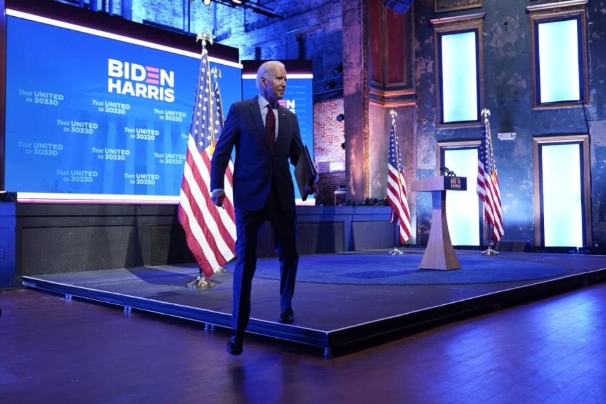 Democratic presidential candidate former Vice President Joe Biden walks off stage after giving a speech on the Supreme Court at The Queen Theater, Sunday, Sept. 27, 2020, in Wilmington, Del.