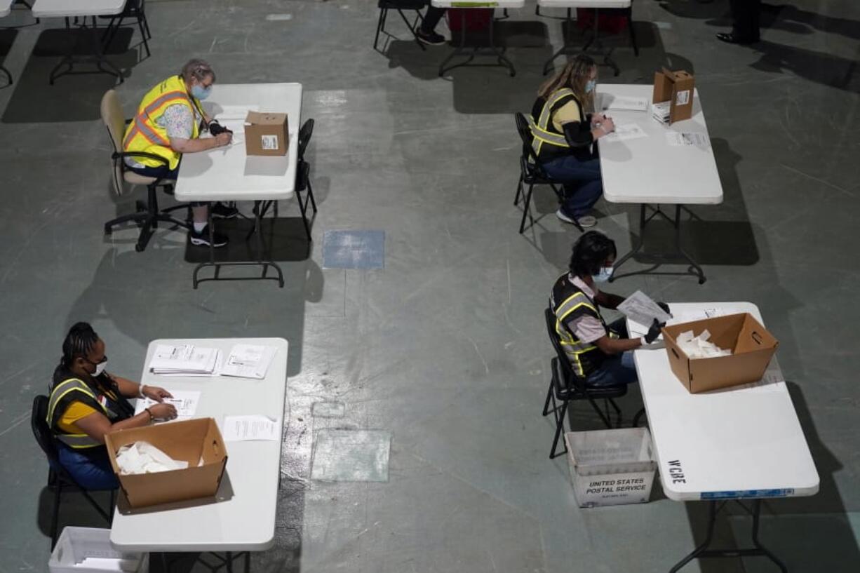 Workers prepare absentee ballots for mailing Sept. 3 at the Wake County Board of Elections in Raleigh, N.C.