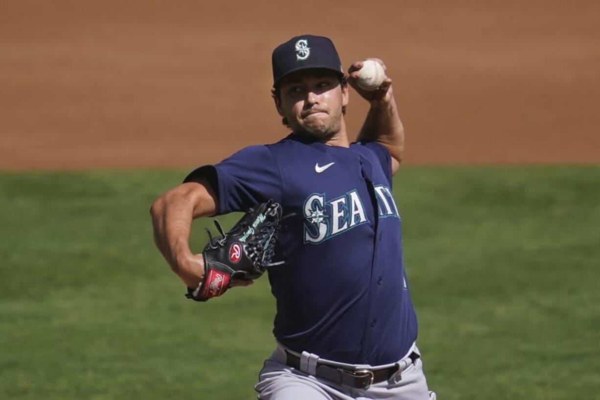 Seattle Mariners&#039; Marco Gonzales pitches against the Oakland Athletics during the first inning of a baseball game in Oakland, Calif., Sunday, Sept. 27, 2020.