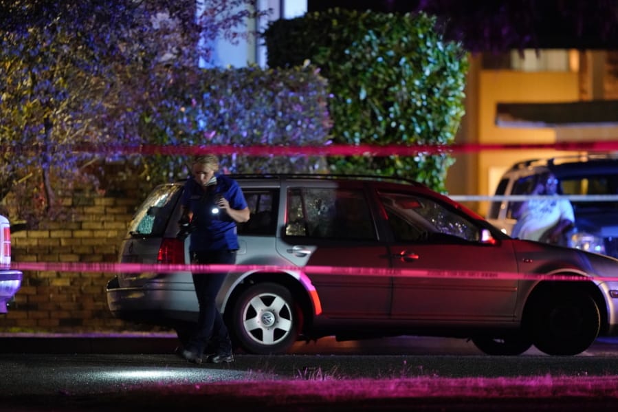 An investigator works at a scene where a man suspected of fatally shooting a supporter of a right-wing group in Portland, Ore., last week was killed as investigators moved in to arrest him in Lacey, Wash., Thursday, Sept. 3, 2020. Michael Reinoehl, 48, was killed as a federal task force attempted to apprehend him in Lacey, a senior Justice Department official said. Reinoehl was the prime suspect in the killing of 39-year-old Aaron &quot;Jay&quot; Danielson, who was shot in the chest Saturday night, the official said.