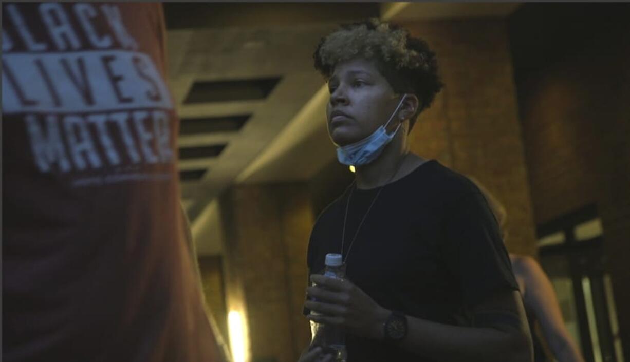 In this image taken from video, activist and rapper Genesis Be leaves her hotel on Thursday, Aug. 27, 2020, in Washington, before attending an event for Vote Common Good, a campaign aimed at Christian voters in swing states. Genesis Be helped ignite a nationwide conversation around the Confederate emblem as part of Mississippi&#039;s state flag until the flag was retired in June.