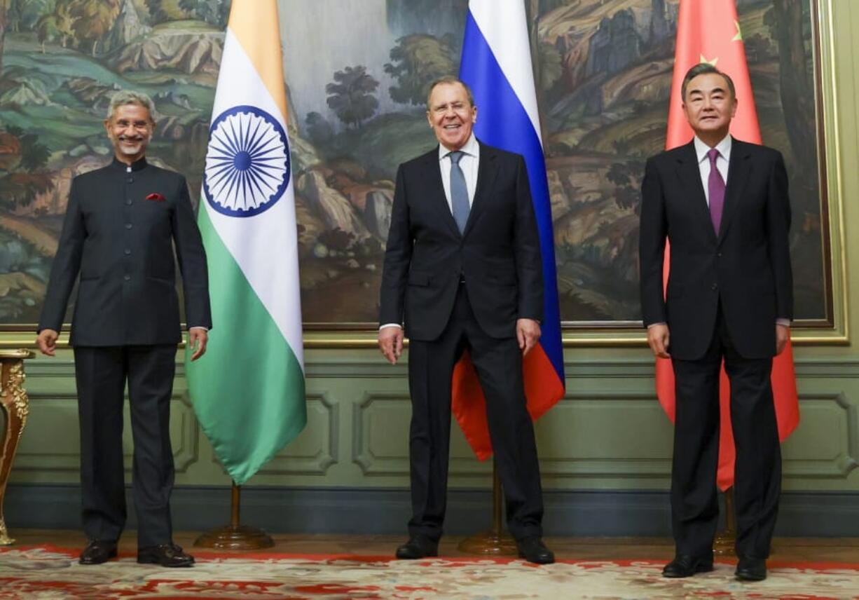 ICAPTION CORRECTS DATE In this photo released by the Russian Foreign Ministry Press Service, India&#039;s Foreign Minister S. Jaishankar, left, Russia&#039;s Foreign Minister Sergey Lavrov, and China&#039;s Foreign Minister Wang Yi, pose for a photo on the sidelines of a meeting of Foreign Ministers of Shanghai Cooperation Organisation, Commonwealth of Independent States and Collective Security Treaty Organization Member States in Moscow, Russia, Thursday, Sept. 10. 2020.