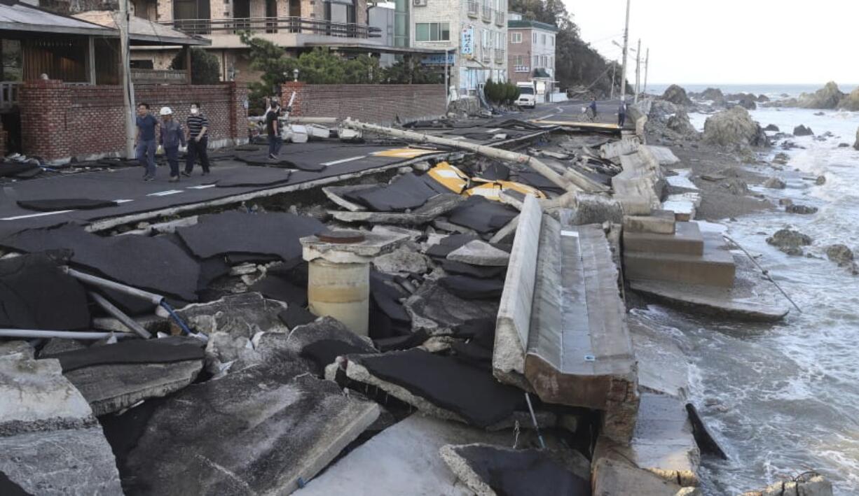 A coastal road is damaged in Ulsan, South Korea, Monday, Sept. 7, 2020. A powerful typhoon damaged buildings, flooded roads and knocked out power to thousands of homes in South Korea on Monday after battering islands in southern Japan and injuring dozens of people.