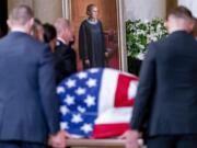 The flag-draped casket of Justice Ruth Bader Ginsburg, carried by Supreme Court police officers, arrives in the Great Hall at the Supreme Court in Washington, Wednesday, Sept. 23, 2020. Ginsburg, 87, died of cancer on Sept. 18.