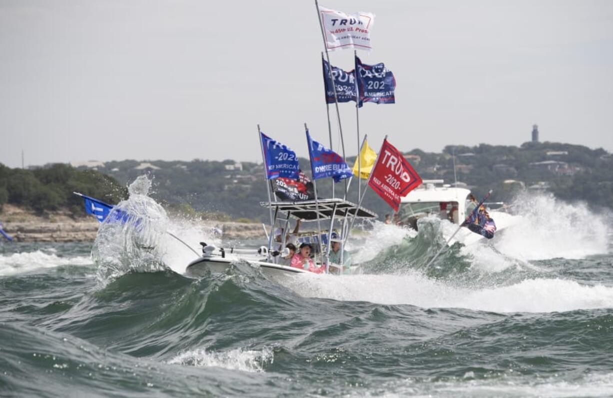 Boaters flying flags honoring U.S. President Donald Trump crowd Lake Travis in Lakeway, Texas, during a boat parade Saturday, Sept. 5, 2020, that attracted hundreds of watercraft of all sizes. Although this boat did not capsize, a spokesperson for the Travis County sheriff&#039;s office in Texas said &quot;several&quot; boats sank Saturday while taking part in the parade in support of Trump. There were no reports of fatalities or injuries.