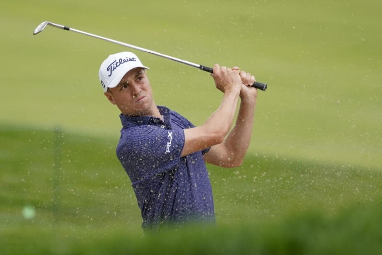 Justin Thomas, of the United States, plays a shot from a bunker on the 17th hole during the first round of the US Open Golf Championship, Thursday, Sept. 17, 2020, in Mamaroneck, N.Y.