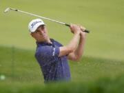 Justin Thomas, of the United States, plays a shot from a bunker on the 17th hole during the first round of the US Open Golf Championship, Thursday, Sept. 17, 2020, in Mamaroneck, N.Y.