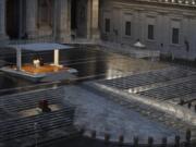 FILE - In this photo taken on March 27, 2020, Pope Francis, white figure standing alone at center, delivers an Urbi et orbi prayer from the empty St. Peter&#039;s Square, at the Vatican. If ever there was a defining moment of Pope Francis during the coronavirus pandemic, it came on March 27, the day Italy recorded its single biggest daily jump in fatalities. From the rain-slicked promenade of St. Peter&#039;s Basilica, Francis said the virus had shown that we&#039;re all in this together, that we need each other and need to reassess our priorities.