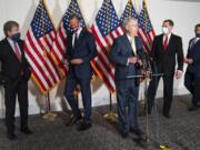 Senate Majority Leader Mitch McConnell of Ky., center, approaches the microphones accompanied by, from left, Sen. Roy Blunt, R-Mo., Sen. John Thune, R-S.D., Sen. John Barrasso, R-Wyo., and Sen. Todd Young, R-Ind., at the start of a news conference, Wednesday, Sept. 9, 2020, on Capitol Hill in Washington.