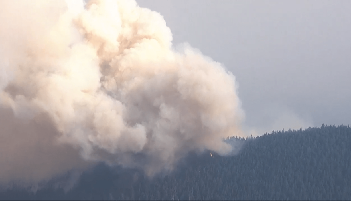 A view from a KPTV helicopter shows the Big Hollow Fire burning on a ridge in the Gifford Pinchot National Forest near Yale Reservoir.