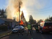 Responding personnel stay back during a chaotic fire scene in Vancouver's Hough neighborhood.