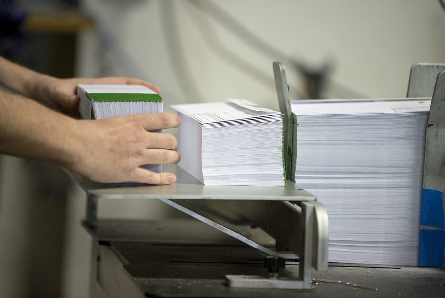 Rick Romero of Send It Direct Mail in Portland helps prepare election ballots for Clark County prior to the 2018 general election.