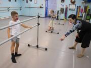 Jeremiah Andryushin, 7, of Vancouver, from left, gets some help with his footwork while joined by his sister, Ada, 4, from dance instructor Liz Borromeo at Liz Borromeo Dance. Borromeo teaches small classes while others join in on Zoom, a platform she hopes to abandon when the pandemic is over. &quot;Zoom is great, I think, for lectures, but it&#039;s a challenging platform for dance,&quot; she said. &quot;The day I get to delete my Zoom account will be a glorious day.