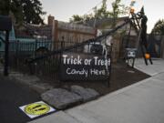 Jim and Ceci Mains&#039; preparations for a pandemic-safe Halloween include 6-foot distance markers and a 20-foot candy slide at their home in west Vancouver.