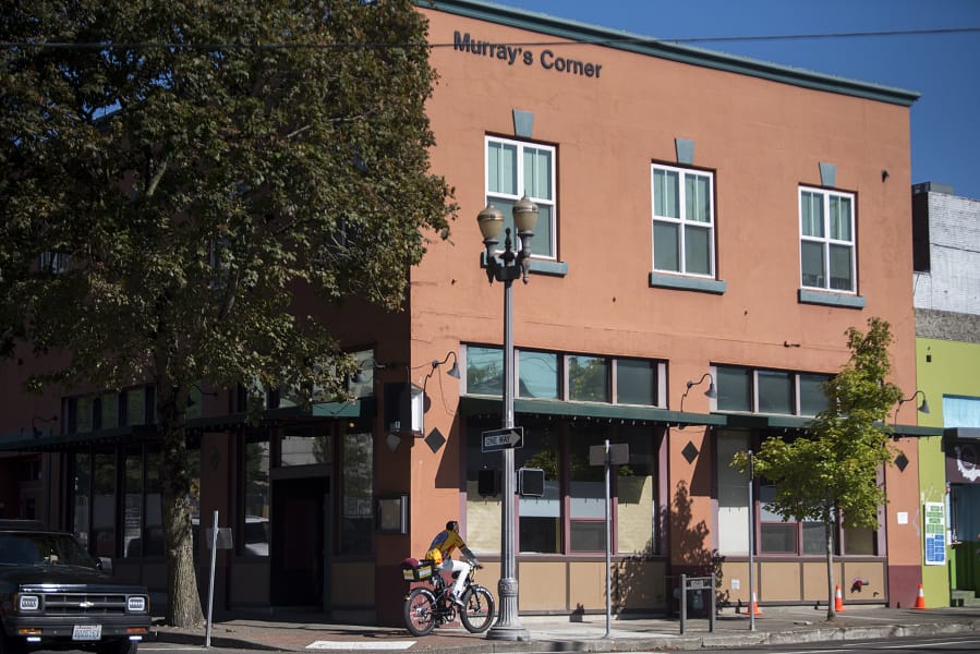 A cyclist rides by the former Tommy O&#039;s downtown restaurant location at the corner of Eighth Street and Washington Street. A new restaurant, The Sedgwick, is opening near the end of the year in the former Tommy O&#039;s spot.