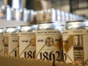 The finished product of 54?40&#039; Brewing&#039;s 1862 Mexican Lager is boxed and put on pallets during a production run in Washougal on Friday morning. A nationwide shortage of aluminum cans is squeezing both big beer and soda makers and smaller companies.