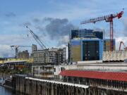 Two tower cranes dot the skyline at The Waterfront Vancouver, one for a hotel, foreground, and the other for an apartment complex. A portable crane is also currently in use.