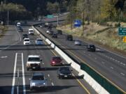 Motorists travel east on state Highway 500 near the intersection with Falk Road. WSDOT officials removed a traffic signal at the intersection two years ago, which has so far resulted in a 68 percent decrease in accidents.