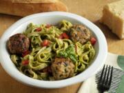 Fettucine with cilantro-almond pesto and chicken meatballs. (E.