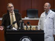 Clark County Public Health Officer Dr. Alan Melnick, left, and Dr. Lawrence Neville, chief medical officer at PeaceHealth Southwest, speak March 13 during a COVID-19 press conference at the Clark County Public Service Center. Seven months later, the pandemic is no closer to being over.