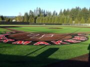 Finishing touches are being put on the installation of a new artificial turf on the junior varsity baseball field at Camas High School on Oct. 27, 2020.