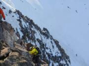 A pair of climbers trek up Mount Jefferson.