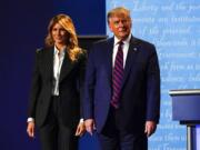 President Donald Trump stands on stage with first lady Melania Trump after the first presidential debate with Democratic presidential candidate former Vice President Joe Biden Tuesday, Sept. 29, 2020, at Case Western University and Cleveland Clinic, in Cleveland, Ohio.