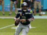 Seattle Seahawks quarterback Russell Wilson (3) looks to pass the ball during the first half of an NFL football game against the Miami Dolphins, Sunday, Oct. 4, 2020 in Miami Gardens, Fla.