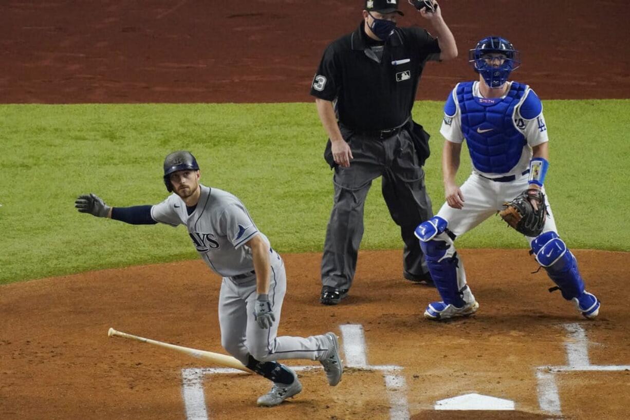 Tampa Bay Rays' Brandon Lowe watches his home run against the Los Angeles Dodgers during the first inning in Game 2 of the baseball World Series Wednesday, Oct. 21, 2020, in Arlington, Texas.