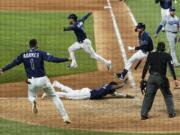 during the == inning in Game 4 of the baseball World Series Saturday, Oct. 24, 2020, in Arlington, Texas. Rays defeated the Dodgers 8-7 to tie the series 2-2 games.