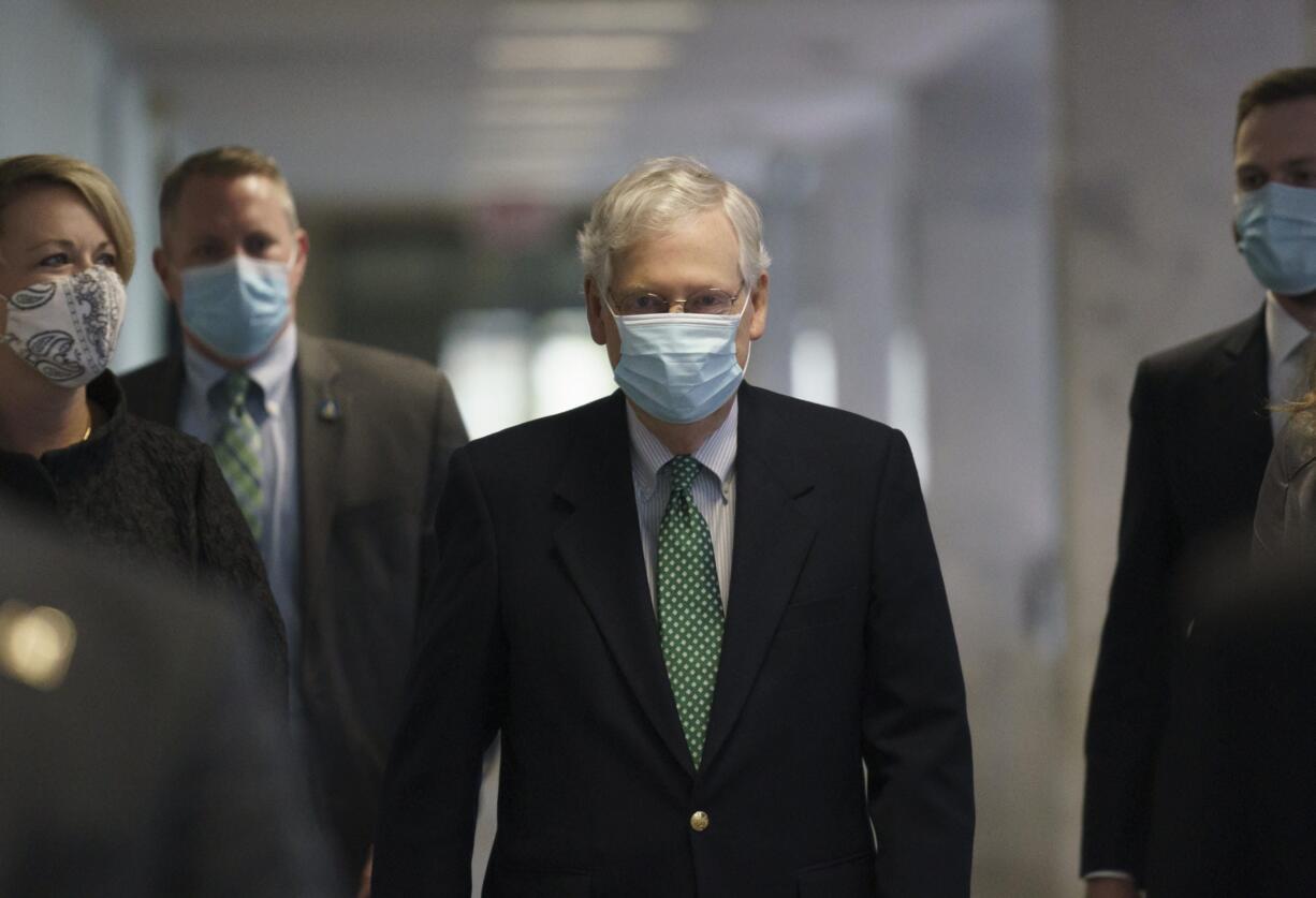 Senate Majority Leader Mitch McConnell, R-Ky., arrives as Republicans work during a rare weekend session to advance the confirmation of Judge Amy Coney Barrett to the Supreme Court, at the Capitol in Washington, Sunday, Oct. 25, 2020. (AP Photo/J.