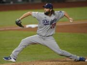 Los Angeles Dodgers starting pitcher Clayton Kershaw throws against the Tampa Bay Rays during the first inning in Game 5 of the baseball World Series Sunday, Oct. 25, 2020, in Arlington, Texas.