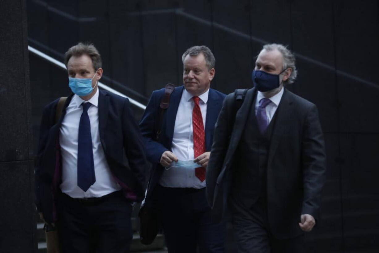 British Brexit negotiator David Frost, center, and Britain&#039;s Ambassador to the European Union Tim Barrow, right, arrive for a meeting with European Commission&#039;s Head of Task Force for Relations with the United Kingdom Michel Barnier at EU headquarters in Brussels, Monday, Oct. 12, 2020.