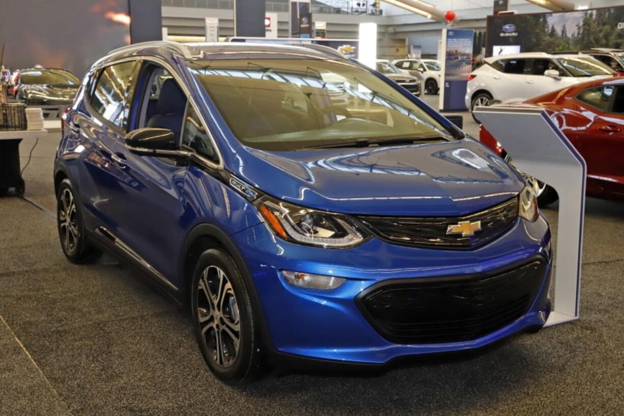 FILE - In this Feb. 13, 2020 file photo a 2020 Chevrolet Bolt EV is displayed at the 2020 Pittsburgh International Auto Show in Pittsburgh. The U.S. government&#039;s road safety agency is investigating complaints that the Chevrolet Bolt electric vehicle can catch fire. The probe by the National Highway Traffic Safety Administration covers nearly 78,000 Bolts made by General Motors from the 2017 through 2020 model years. (AP Photo/Gene J.