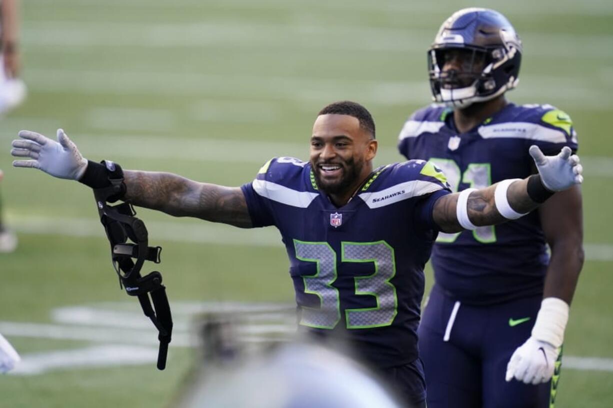 Seattle Seahawks strong safety Jamal Adams (33) celebrates after the Seahawks beat the Dallas Cowboys 38-31 in an NFL football game, Sunday, Sept. 27, 2020, in Seattle.