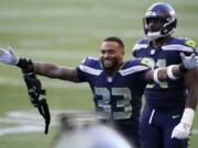 Seattle Seahawks strong safety Jamal Adams (33) celebrates after the Seahawks beat the Dallas Cowboys 38-31 in an NFL football game, Sunday, Sept. 27, 2020, in Seattle.