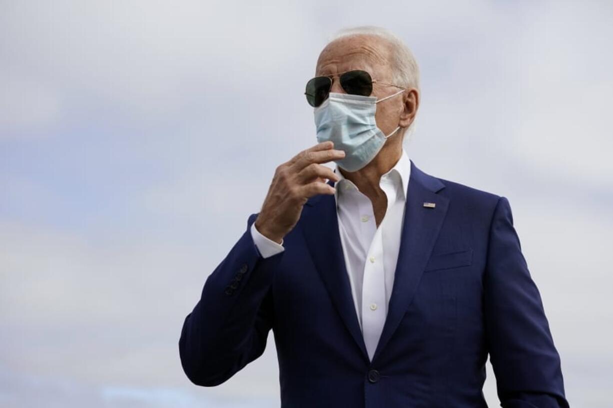 Democratic presidential candidate former Vice President Joe Biden speaks to members of the media before boardin his campaign plane at New Castle Airport, in New Castle, Del., Tuesday Oct. 13, 2020, en route to Florida.