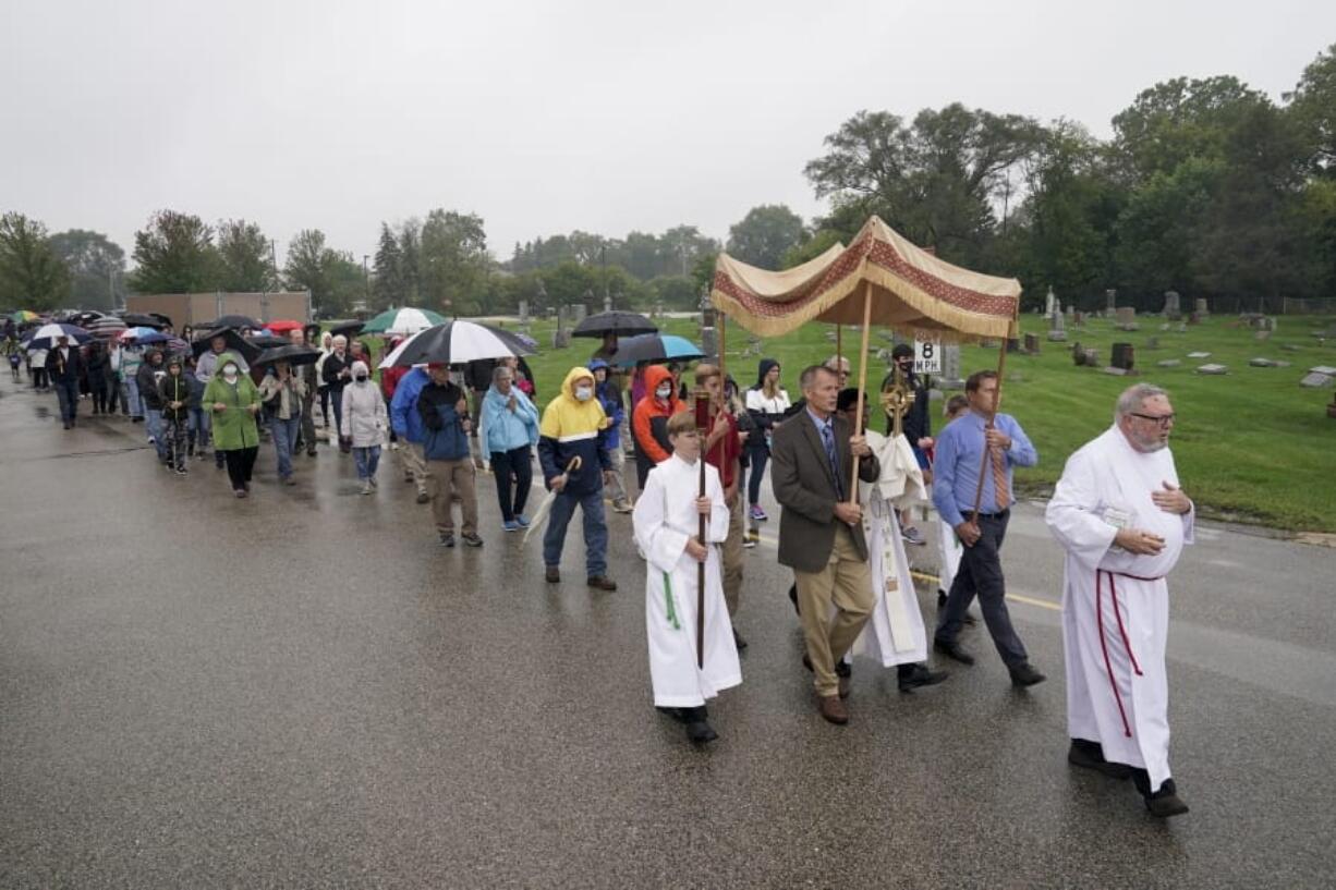 Churchgoers participate in a procession at the Holy Apostles Church in Milwaukee on Sept. 12.