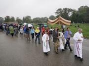 Churchgoers participate in a procession at the Holy Apostles Church in Milwaukee on Sept. 12.