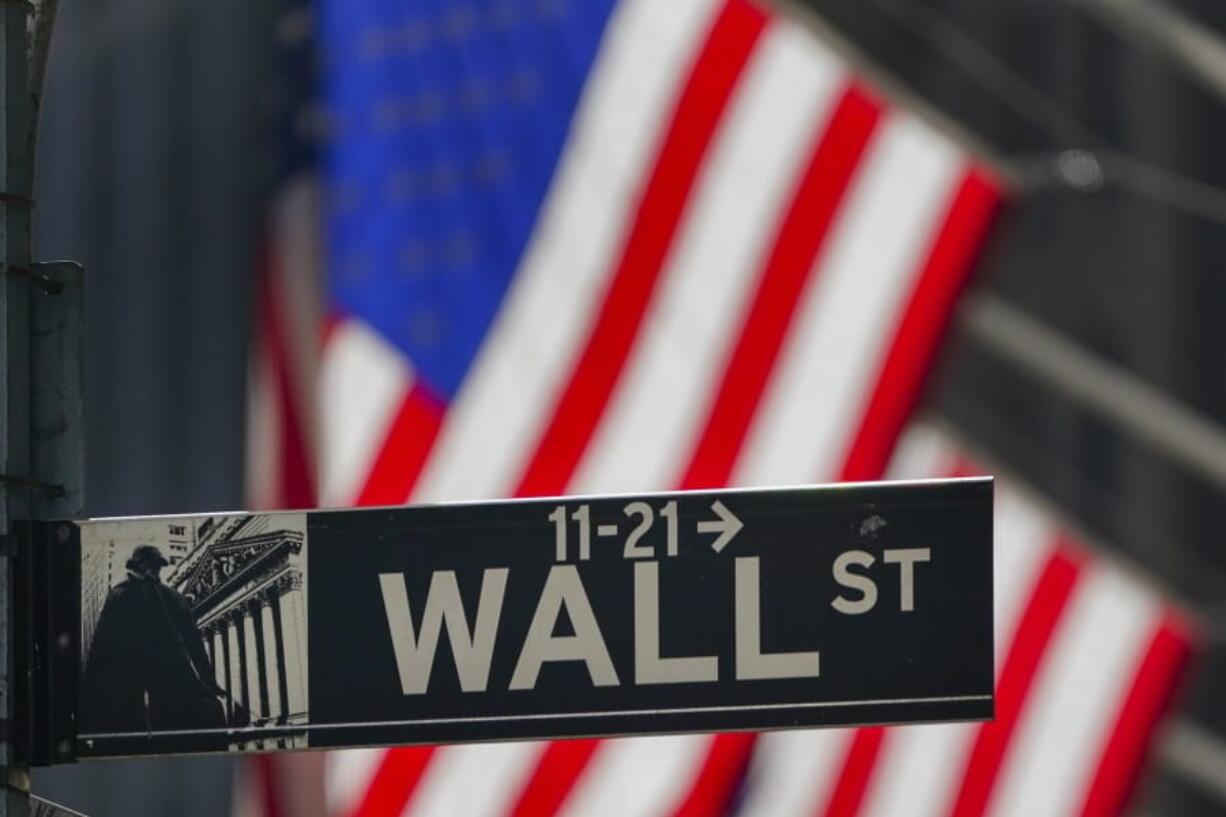 FILE - In this Wednesday, Oct. 14, 2020 file photo, the American Flag hangs outside the New York Stock Exchange in New York. Stocks are opening higher on Wall Street, putting the market on track to end a choppy week of trading slightly higher. If the gains hold, the S&amp;P 500 would mark its third straight weekly gain. In the first few minutes of trading Friday, Oct. 16 the benchmark index was up 0.4%.