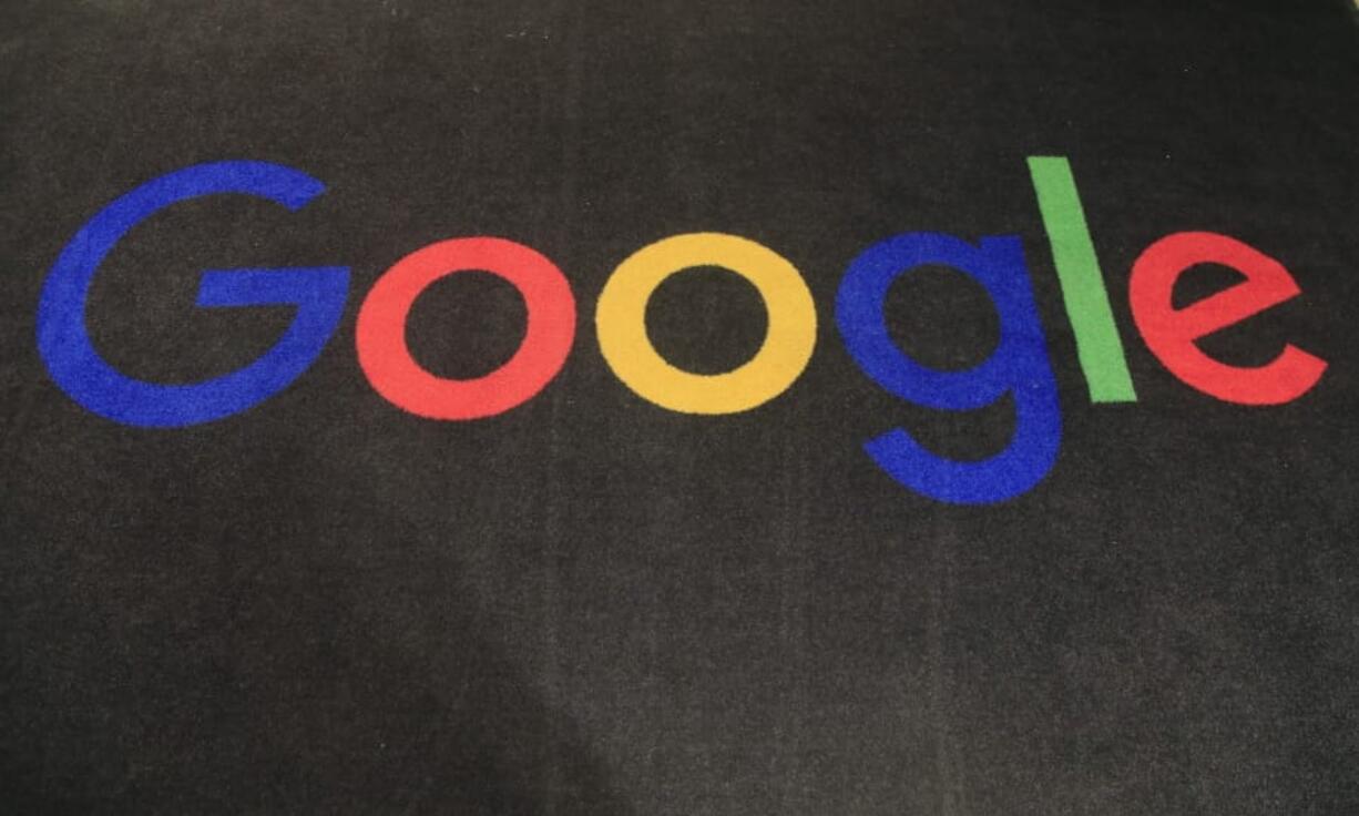 FILE - In this Monday, Nov. 18, 2019, file photo, the logo of Google is displayed on a carpet at the entrance hall of Google France in Paris. The Trump administration&#039;s legal assault on Google actually feels like a blast from the past.