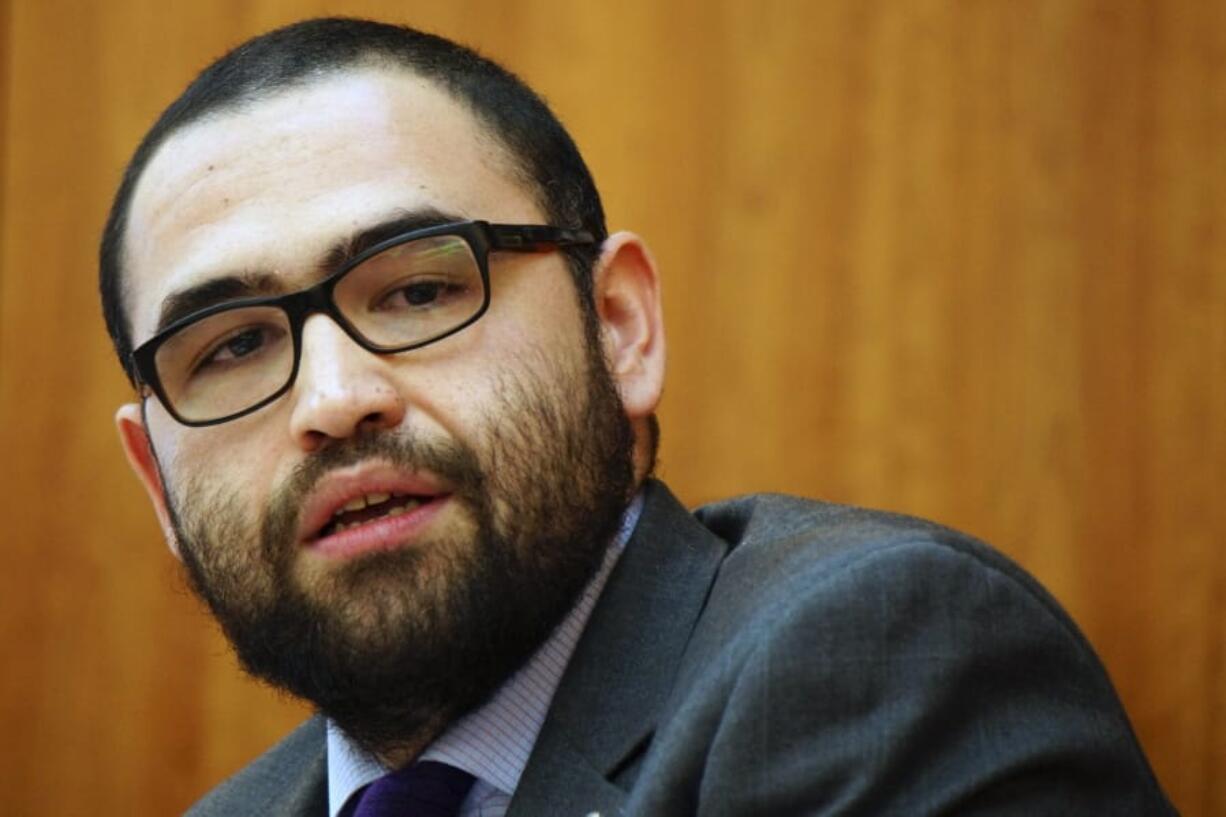 FILE - In this March, 10, 2015, file photo, New Mexico state Sen. Jacob R. Candelaria speaks during the Senate Public Affairs Committee at the state Capital in Santa Fe, N.M. On Sunday, Oct. 25, 2020, Candelaria said he received anonymous threatening telephone messages shortly after publicly criticizing a political demonstration that took place outside the state Capitol, and that he fears for his safety. (Luke E.