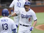 Los Angeles Dodgers&#039; Corey Seager celebrates his home run against the Atlanta Braves during the first inning in Game 6 of a baseball National League Championship Series Saturday, Oct. 17, 2020, in Arlington, Texas.