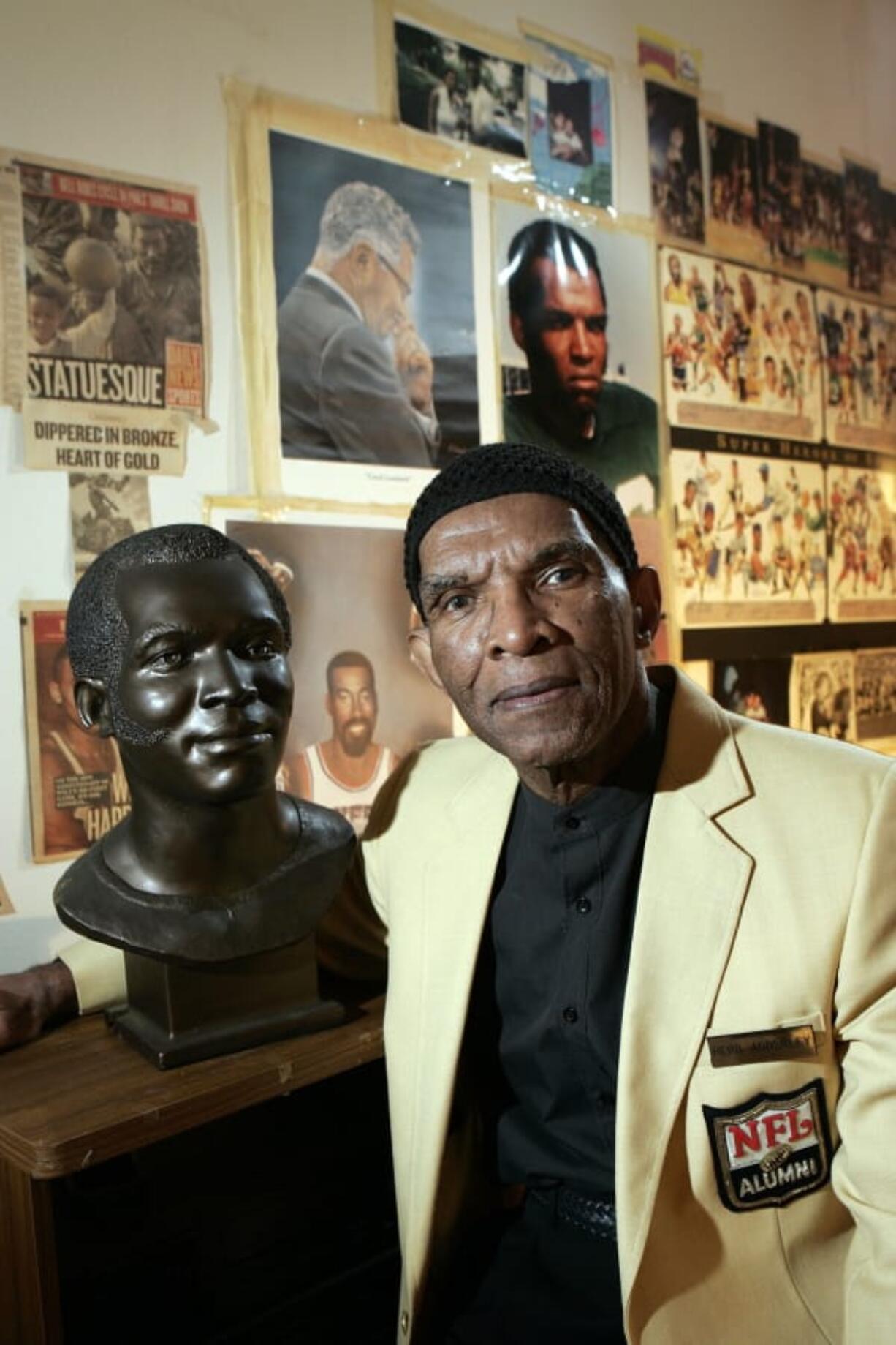 Former NFL player Herb Adderley poses next to a copy of his Hall of Fame bust in a room full of memorabilia from his playing days on Oct. 2, 2008, at his home in Mantua, N.J. The Hall of Fame cornerback has died at age 81. His death was confirmed Friday, Oct. 30, 2020, on Twitter by nephew Nasir Adderley, a safety for the Los Angeles Chargers. Adderley played on six NFL title teams over a 12-year career with Green Bay and Dallas.