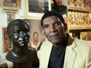 Former NFL player Herb Adderley poses next to a copy of his Hall of Fame bust in a room full of memorabilia from his playing days on Oct. 2, 2008, at his home in Mantua, N.J. The Hall of Fame cornerback has died at age 81. His death was confirmed Friday, Oct. 30, 2020, on Twitter by nephew Nasir Adderley, a safety for the Los Angeles Chargers. Adderley played on six NFL title teams over a 12-year career with Green Bay and Dallas.