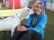 In this Sept. 21, 2019 photo, Marcia Hamilton, a volunteer at Maricopa County Animal Care and Control, plays with Celia at the shelter in Phoenix, Ariz. There are many ways to volunteer at an animal shelter to improve the lives of the animals waiting there for a forever home. (AP Photo/Michelle A. Monroe) (Michelle A.