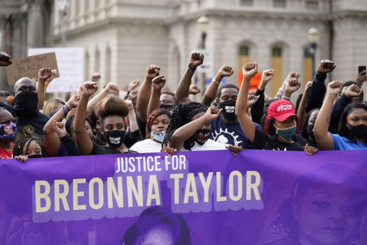 FILE - In this Sept. 25, 2020, file photo, Black Lives Matter protesters march in Louisville. Hours of material in the grand jury proceedings for Taylor&#039;s fatal shooting by police have been made public on Friday, Oct. 2.